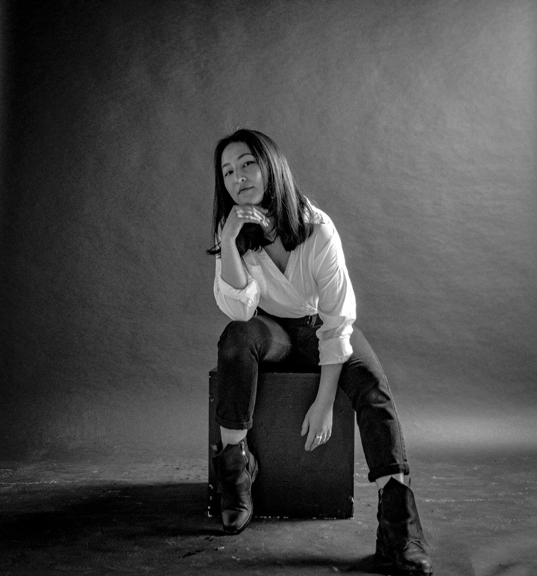 Studio portrait of an Asian woman in professional attire