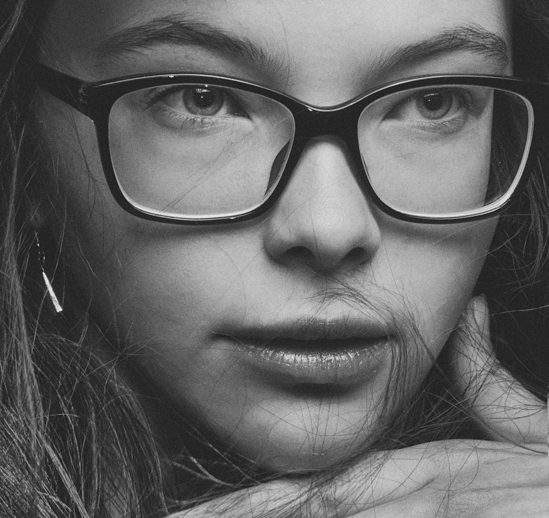 Studio portrait of a European woman with glasses
