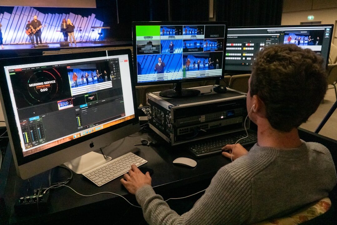 Technical director monitoring live video feeds on screens